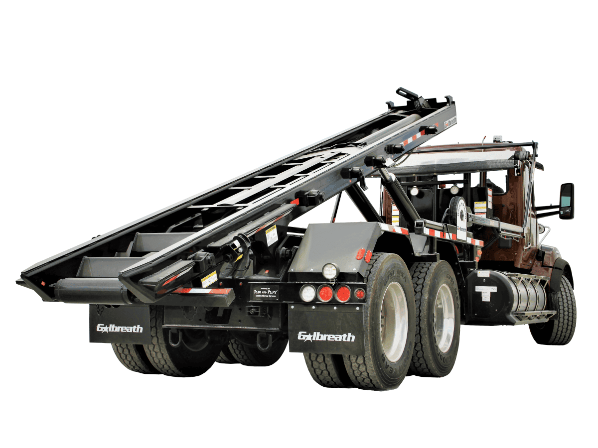 Brown Roll-off truck with extended lift.