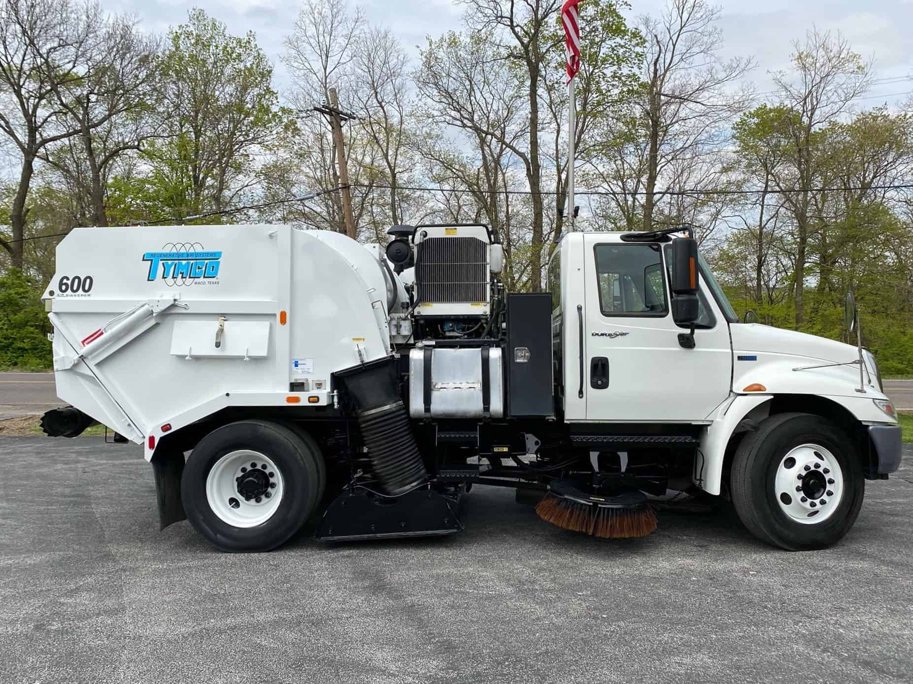White Tymco 600 Passenger Side Armor Equipment Truck