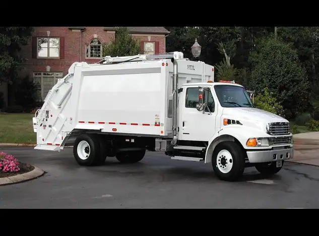 Heil With PT1000 With Cart Tippers-Armor Equipment Truck Front Side View